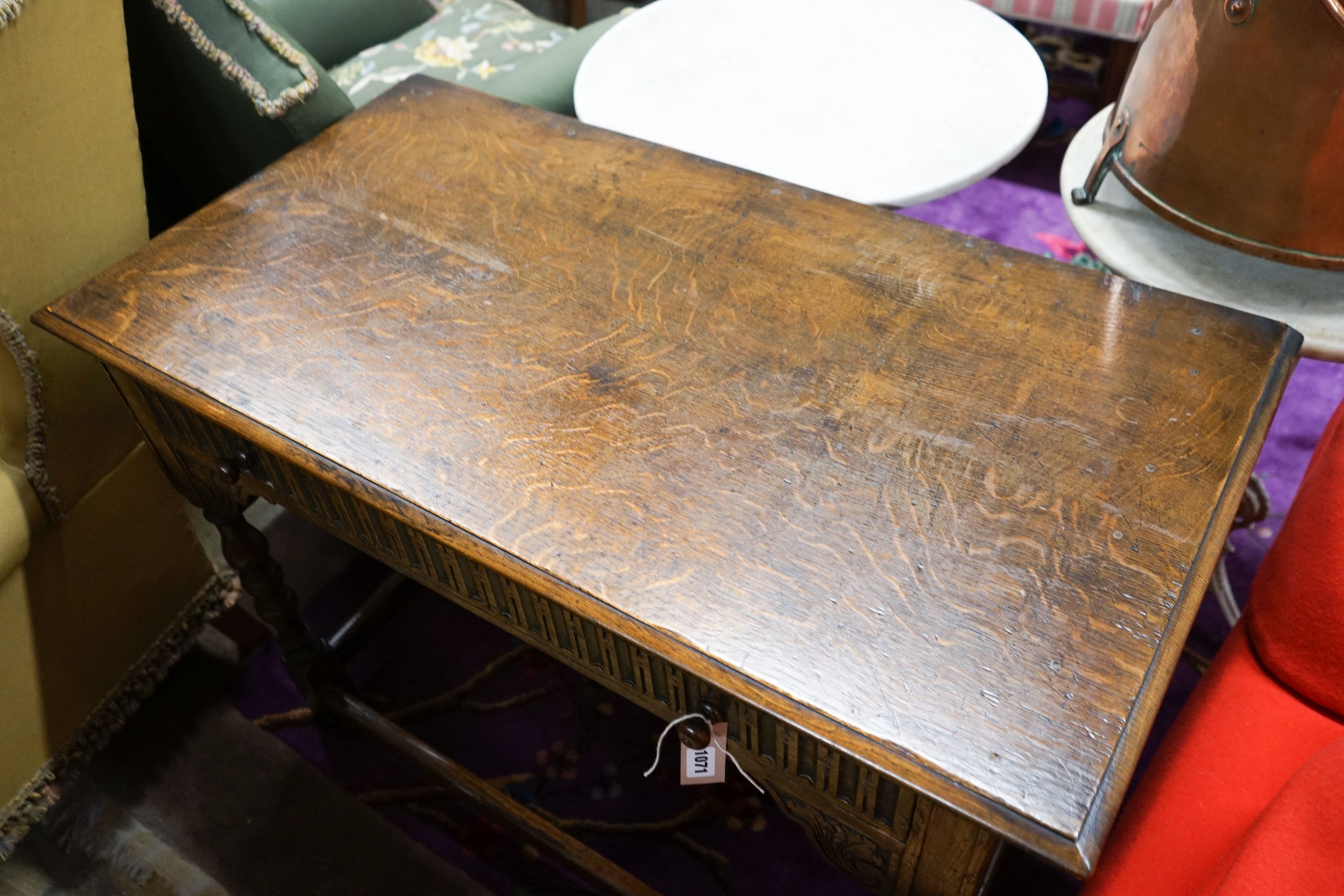 A 17th century style carved oak side table, width 107cm, depth 56cm, height 76cm